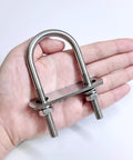 Hand holding Four Set M8 Stainless Steel U Bolts Kit With Nuts Washers And Plate 40mm Wide 90mm Long 304 Grade U Bolts