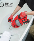 Person using 20V Cordless Drain Auger Auto Feed 25 Ft Drain Snake With Replaceable Cable in bathtub clog clearing.