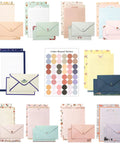 Ultimate 91 Piece Stationery Set with 60 lined writing papers, 30 envelopes, colorful stickers, and vintage styles displayed.