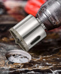 HARFINGTON diamond tile hole saw 5/8 in with center guide, close-up mounted on a drill for ceramic tile cutting.