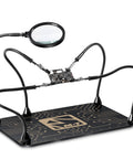 M-T Helping Hands soldering station with four adjustable arms, PCB holder, and 5x magnifying glass on weighted steel base