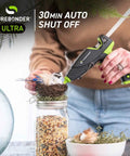 Person using Auto Shut Off Hot Glue Gun Dual Temperature Full Size 60W for crafting, visible with jar and bird nest.