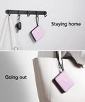 Keep Your Gadgets Juiced 10000mAh Power Bank With Four Built In Cables Fast Charging Portable Battery Pack For Smartphones And Tablets Lightweight Travel Charger In Bold Purple hanging on hooks.