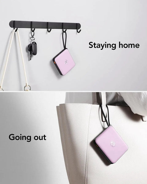 Keep Your Gadgets Juiced 10000mAh Power Bank With Four Built In Cables Fast Charging Portable Battery Pack For Smartphones And Tablets Lightweight Travel Charger In Bold Purple hanging on hooks.