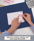 Hands applying fragile sticker on document over 50 Pack Extra Large 14 By 18 Inch Blue Mailing Envelopes 32 Lb With Gummed Flaps