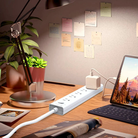 8-Outlet Surge Protector Power Strip with Flat Plug, 5 AC Outlets, 3 USB Ports, on desk near laptop, 4.5 Foot Extension Cord