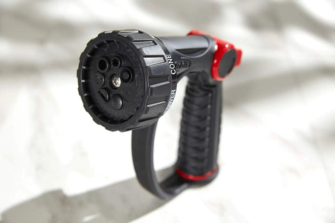 7 Pattern Watering Nozzle With Thumb Control For Backyard Bosses From Rainlike Shower To Powerful Jet Includes Shower Center Flat Mist Full And Jet Modes Longer Reach Higher Flow Black nozzle showing front view of spray head with grip handle.