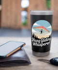 Hang Glider Whisperer Stainless Steel Insulated Tumbler with bold hang gliding artwork, 20 oz on the go bottle in a cozy setting.