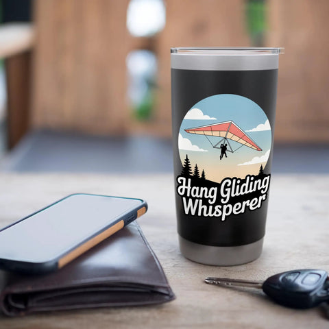 Hang Glider Whisperer Stainless Steel Insulated Tumbler with bold hang gliding artwork, 20 oz on the go bottle in a cozy setting.