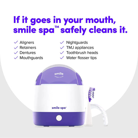 Ultra Deep Clean Ultrasonic And UV Dental Appliance Cleaner For Aligners, Retainers, Dentures, Mouthguards, Toothbrush Heads And More With Dual Cleaning Tech For A Fresh, Odor Free Smile. White and purple countertop cleaner with brush and water flosser tip.