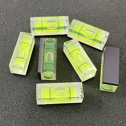 Six Pack Mini Magnetic Bubble Level Kit Sleek Acrylic Build With Neon Vials Always Dead On For Quick Measurements on black background.