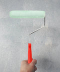 Easy Peasy Mini Paint Roller Brush With Comfy Handle For Smooth Ceiling And Cabinet Repainting Precision Edge Tool in hand.