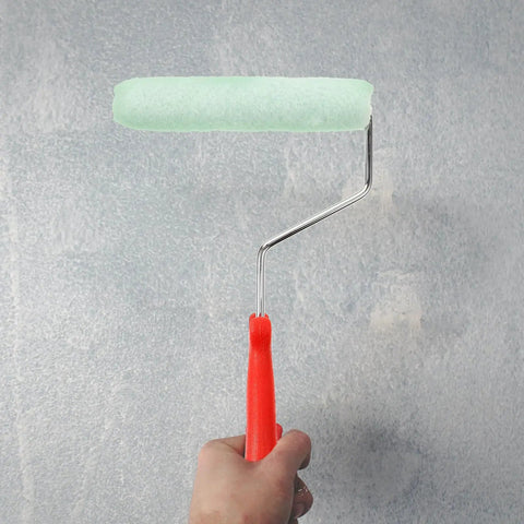 Easy Peasy Mini Paint Roller Brush With Comfy Handle For Smooth Ceiling And Cabinet Repainting Precision Edge Tool in hand.