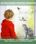 Child and cat watching birds at window with Window Bird Feeder With 4 Ultra Strong Suction Cups, Clear Dual Seed Tray