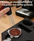 Game Changer 51 Mm Espresso Accessory Bundle featuring WDT wand breaking coffee clumps on a barista station.
