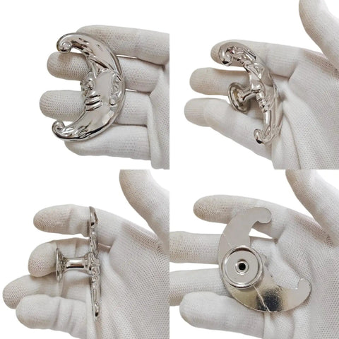 Four Piece Crescent Moon Cabinet Knobs Vintage Retro Drawer Pulls With Moody Carved Faces For Gothic Boho Kitchen And Vanity Hardware showing silver knobs in hand.