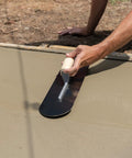 Person using Pool Trowel With 20 Inch Blue Steel Blade Flexible For Radius Finishes Wood Handle Short Aluminum Alloy Mounting