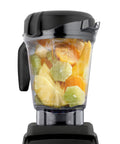 64 Oz Low Profile Blender Container Clear BPA Free Eastman Tritan Copolyester 4 Inch Blade Diameter G Series Compatible With 5300 For Big Batches Fits Under Most Cabinets Not For Ascent, filled with fruits, front view on blender base.