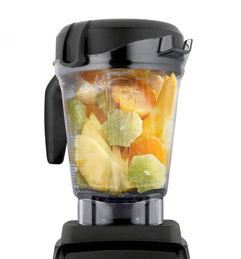 64 Oz Low Profile Blender Container Clear BPA Free Eastman Tritan Copolyester 4 Inch Blade Diameter G Series Compatible With 5300 For Big Batches Fits Under Most Cabinets Not For Ascent, filled with fruits, front view on blender base.