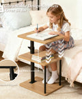 Built Tough 360 Degree Swivel C Shaped End Table With Roomy Three Tier Open Storage Rack And Heavy Duty Metal Frame Featuring Slick Oak Finish For Couch Or Bedside with a child drawing on it.