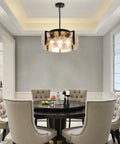 Get The Low On This Badass Matte Black 4 Light Adjustable Chandelier With Metal Frame To Drop Some Serious Glow Over Dining Tables Kitchen Islands Bedrooms Or Bathrooms Today. Hanging above a round dining table.