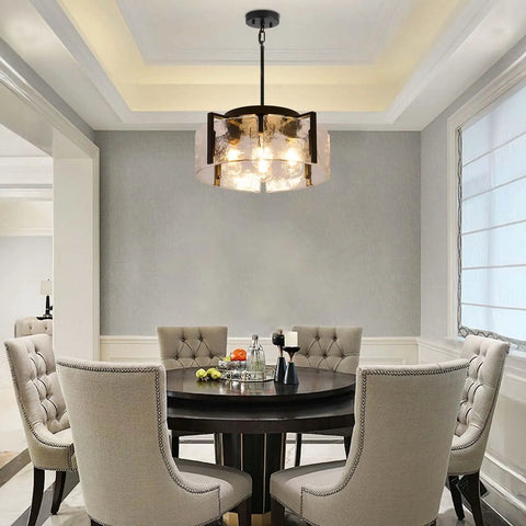 Get The Low On This Badass Matte Black 4 Light Adjustable Chandelier With Metal Frame To Drop Some Serious Glow Over Dining Tables Kitchen Islands Bedrooms Or Bathrooms Today. Hanging above a round dining table.