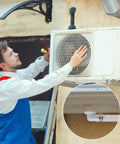 Technician installing 10 Foot Universal Air Conditioner Drain Hose With Elbow Fitting For Window AC And Mini Split Units