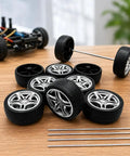 Ten Pack 48mm Toy Car Rubber Wheels With 5 Shaft Axles For RC Cars Trucks Robots DIY Models And Hobby Builds displayed on table