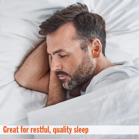 Man sleeping with Maximum Noise Blocking Soft Foam Earplugs 50 Pairs With 33 dB NRR For Sleep Snoring Loud Concerts Motorcycles And Power Tools