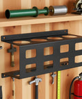 Welding Electrode Storage Wall Mount Organizer with four tube rod rack, made of heavy duty steel, mounted on workshop wall.