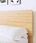 Close-up of the Natural Bamboo King Size Platform Bed Frame With Headboard showcasing a smooth bamboo headboard.