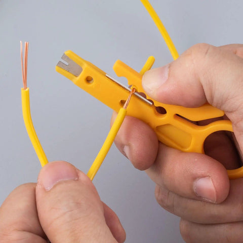 10 Piece Mini Wire Stripper Set With Secure Finger Loop for 5-6.2mm Cables and Data Wires, ergonomic yellow ABS handle in use.