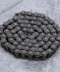 Heavy Duty Carbon Steel Roller Chain 0.5 Meter Length coiled on a surface, ideal for cutting with pliers and building TETRIX FTC robots.