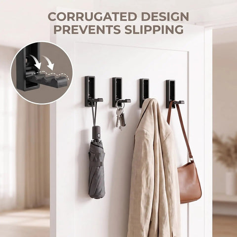 8 Pack Foldable Wall Hooks Matte Black Zinc Alloy mounted on wall displaying keys, umbrella, and jacket for space saving organization