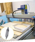 Center drill bit, 60° high-speed steel, inset beside a CNC router cutting a wooden workpiece.