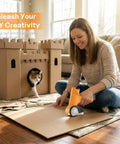 A woman using Automatic Electric Scissors For Fabric And Carpet Cutting Rechargeable Cordless Power Craft Tool on cardboard.