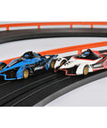 Two cars on a track from the Infinity HO Slot Racing Set With Upgraded Controllers, Realistic Handling And Tune Up Kit.