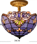 Tiffany Style Baroque Stained Glass Ceiling Light Fixture In Blue And Purple Semi Flush Mount 12 Inch Shade 11 Inch Height Antique Green Bronze Finish Hardwired Ceiling Fixture Requires Two LED Modules, with intricate design close-up