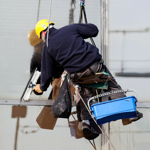 Worker using Heavy Duty 30KN Swing Swivel With Dead Silent 360 Rotation And Smooth Glide Design for cleaning windows.