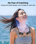 Woman enjoying breeze from Portable Neck Fan for Hands Free Cooling, Lightweight Wearable Personal Fan With 360 Degree Adjustability And Ultra Quiet, Strong Wind, Ideal for Travel, Cruise, Outdoors, Sports, Hot Flashes And Summer by the sea