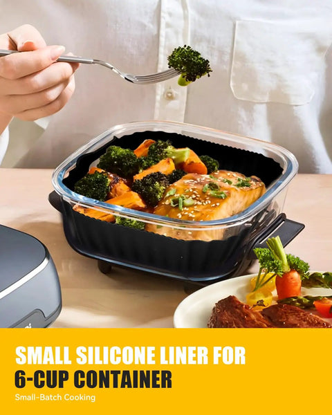 Person using small silicone liner for 6-cup container with broccoli and salmon