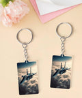 Two Fighter Jet Acrylic Keychain With Chain And Jump Ring on table, featuring double-sided jet design. Ultra Lightweight Charm.