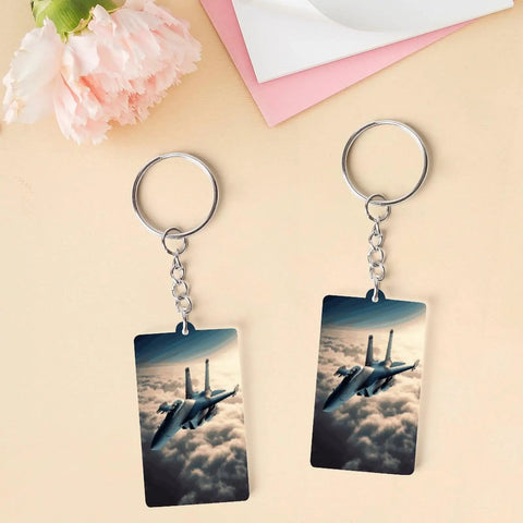 Two Fighter Jet Acrylic Keychain With Chain And Jump Ring on table, featuring double-sided jet design. Ultra Lightweight Charm.