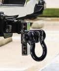 Damn Tough D Ring Shackles 3 4 Inch Beefy Forged Steel Towing Hardware 2 Pack With Safety Pin attached to truck hitch.