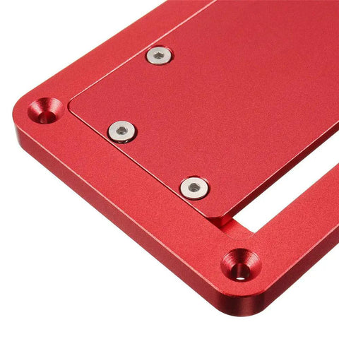 Close-up of red aluminum table saw throat plate with flip cover, part of the Table Saw Throat Plate With Flip Cover For Upside Down Cuts.