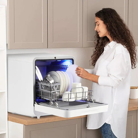 No Sweat Countertop Portable Dishwasher featuring faucet hookup and self prime pump with dishes inside.
