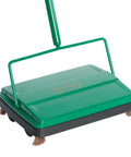 Heavy Duty Electrostatic Carpet And Floor Sweeper Lightweight Manual Cleaner For Smooth Floors and Low Pile Rugs Quick Clean Sweep Clears Crumbs And Dust Cordless Design visible in green and black with bristles.