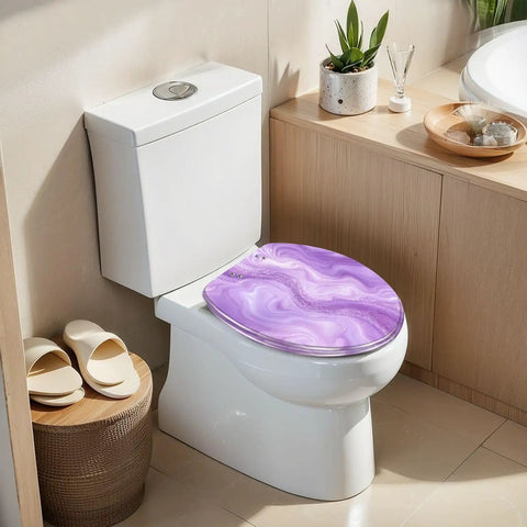 Elongated Abstract purple liquid marble watercolor glitter Toilet Seat on a modern toilet, showcasing its elegant design in a bathroom setting.