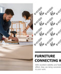 Two In One 50 Pack 28mm Alloy Furniture Connectors Kit beside people assembling furniture.