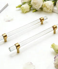 Brushed Brass And Clear Acrylic Cabinet Pulls, Modern T Bar Design, 11.2 Inch Total Length, 9 Inch Hole Center, shown with flowers
